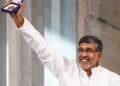 FILE - In this Dec. 10, 2014 file photo, Nobel Peace Prize joint-winner Kailash Satyarthi of India holds up his Nobel Peace Prize medal during the Nobel Peace Prize award ceremony in Oslo, Norway. Police say Satyarthi's apartment in the Indian capital has been burgled and a gold-plated replica of his medal and the citation have been found missing. His son, Bhuvan Ribhu, says the theft occurred Monday, Feb. 6, 2017, night while his father and mother were on a visit to Panama. (AP Photo/Cornelius Poppe, NTB Scanpix) NORWAY OUT